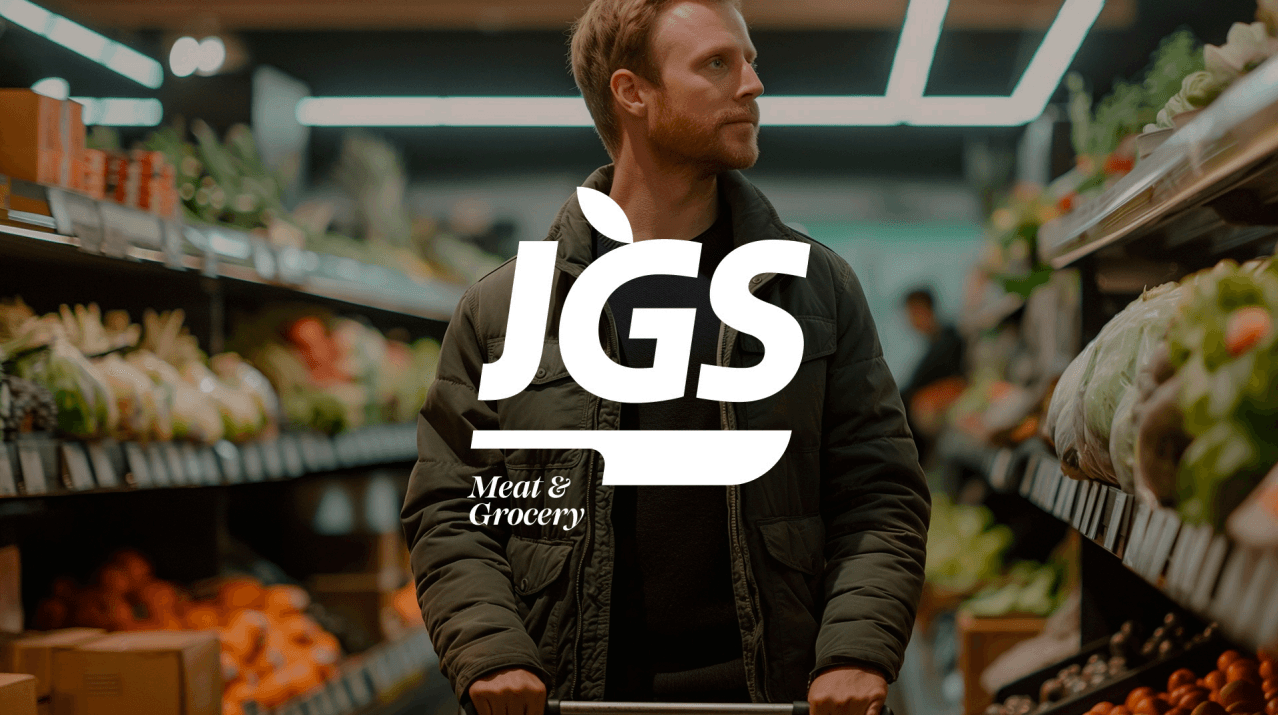 A shopper in a JGS grocery aisle, with the JGS Meat and Grocery logo overlaid